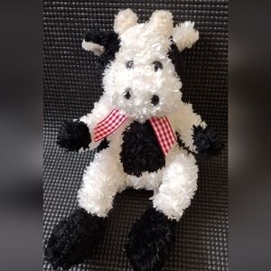 World Market - Cow Plush Toy in Black/White With A Red Gingham Bow.